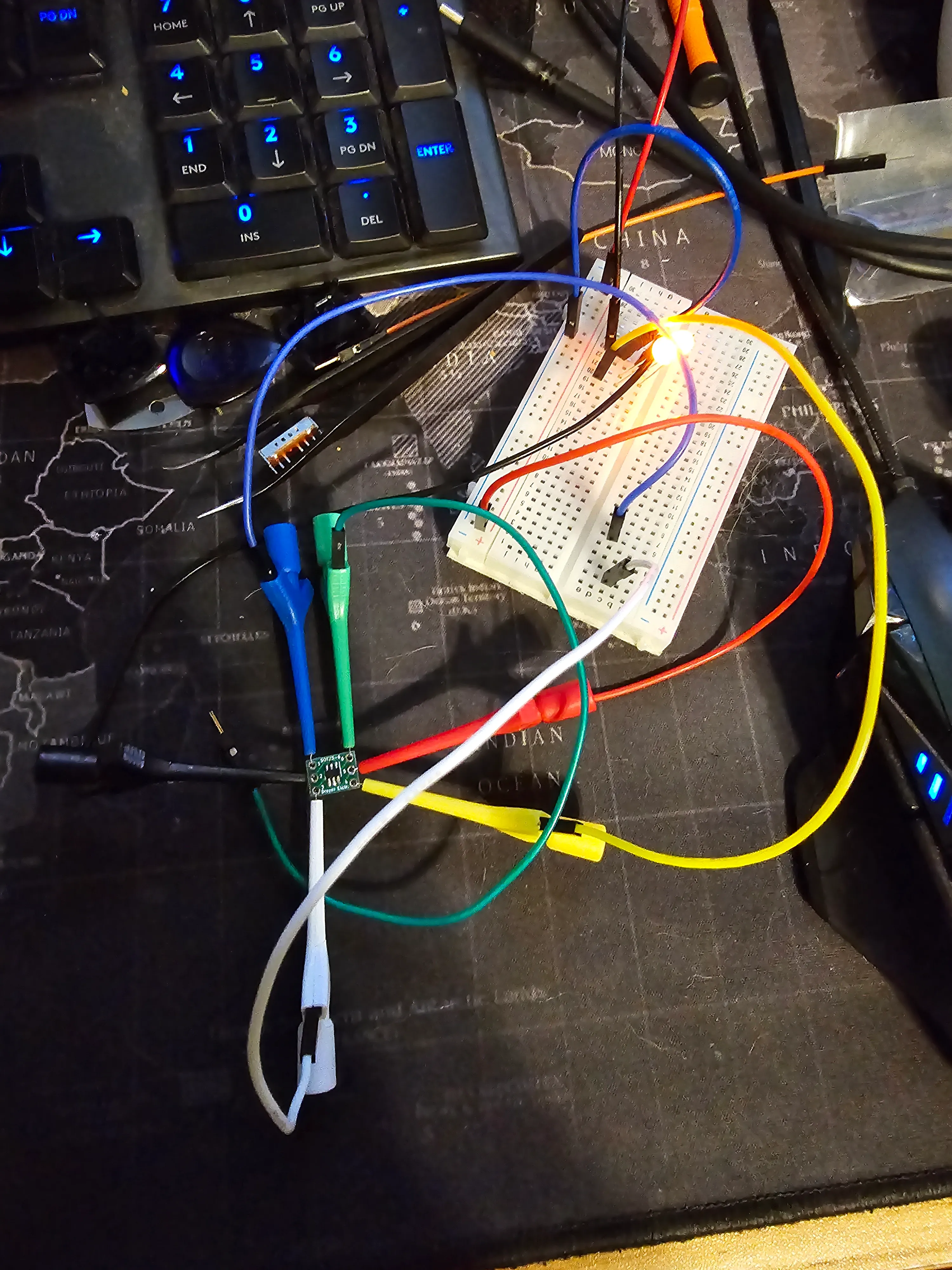 Early breadboard prototype with a single LED lit, wired to the ATtiny10