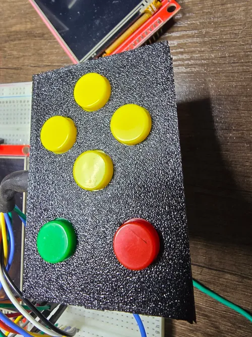 Textured test print of the six-button plate sitting over the breadboard wiring