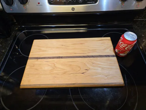 Another cherry cutting board with an off-center walnut stripe