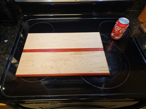 Maple cutting board with a bloodwood accent stripe