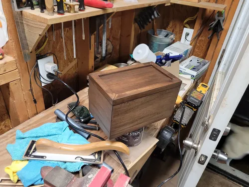 Unfinished mahogany box with stained lid before hardware installation