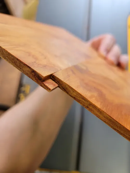 Two thin panels joined to make a full-width lid piece